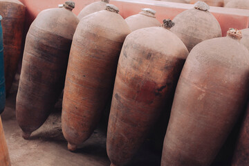 Ceramic barrels for wine and pisco production in the distillery, in Ica, Peru. - obrazy, fototapety, plakaty