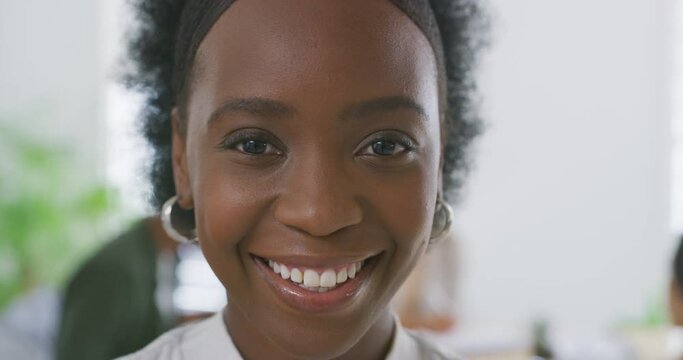 Face, employee and black woman with a smile, business and career with entrepreneur and web designer. Portrait, African person and consultant in a workplace and professional with startup and worker