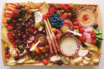 Antipasto platter with meat, chease, fruits, vegetables and nuts. Appetizer, catering food concept - 741618891
