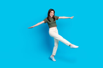 Fototapeta na wymiar Full body photo of nice overjoyed lady have good mood dancing chilling isolated on blue color background