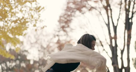 Japanese woman, trees and dancing in park, moving body and freedom for street performance in nature. Girl, dancer and person with art, concert and steps with creativity, face and balance in Tokyo