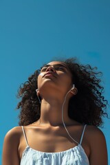 Woman's Portrait: Headphones On, Gazing at Sky, Listening to Music Outside