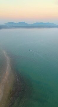 Drones are flying over Koh Phitak or Phithak island in Chumphon, Thailand, Vertical Video.