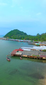 Drones are flying over Koh Phitak or Phithak island in Chumphon, Thailand, Vertical Video.