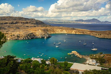 Yachts are moored in the bay of Lindos.