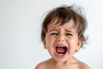 Toddler boy crying with expression of sadness and frustration. Child emotions.