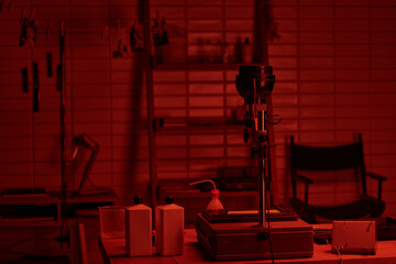 darkroom interior with chemical bottles poised for use in the analog film development process