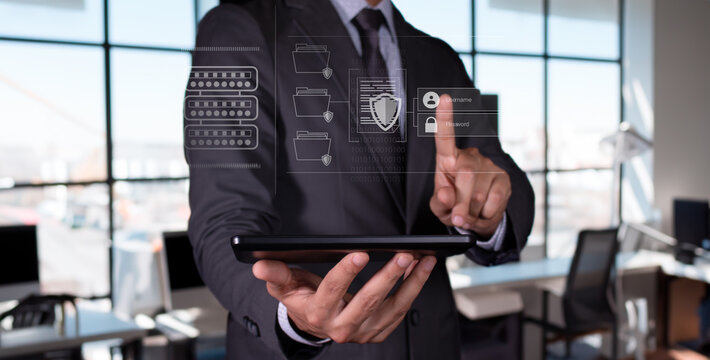 Data protection concept. businessman holds tablet and tries to access protected files.