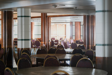 Wood paneled Art Deco interior design architecture inside lounge bar public space onboard ocean...