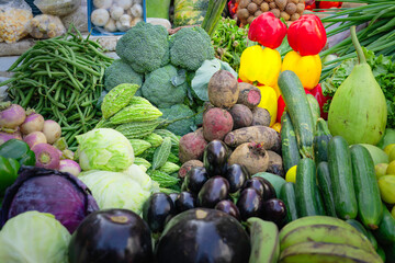 Street stall selling a large selection of vegetables. Delhi, India.