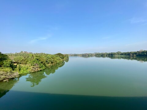 Wide bed of a river flowing through green forests in the jungles around Sakaleshpura in Karnataka in South India.