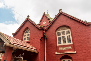 The gable roofs of the Breeks Memorial Higher Secondary School in the town of Udhagamandalam.