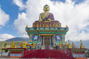 Giant buddha statue with bright blue sky at evening in tawang arunachal pradesh india.