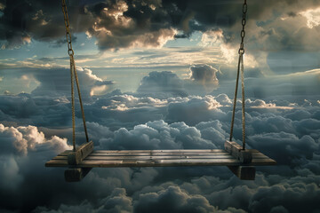 Solitary swing hangs from a tree branch, suspended above clouds. Surreal concept of serenity