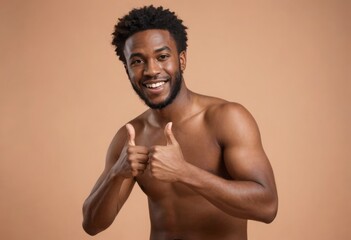 A shirtless man with a bright smile making a thumbs up gesture.