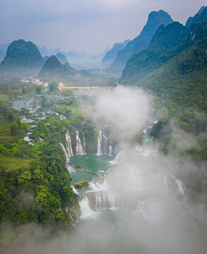 Aerial view of Detian Transnational Waterfalls along the river at Moon Hill Yangshuo valley, Chongzuo City, Yangshuo County, Guilin, Guangxi Zhuang Autonomous Region, China.