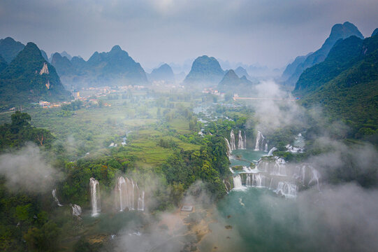 Aerial view of Detian Transnational Waterfalls along the river at Moon Hill Yangshuo valley, Chongzuo City, Yangshuo County, Guilin, Guangxi Zhuang Autonomous Region, China.