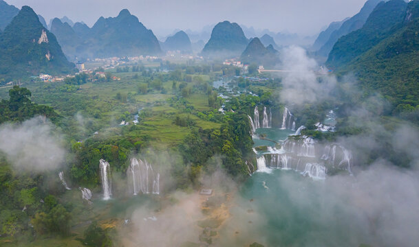 Aerial view of Detian Transnational Waterfalls along the river at Moon Hill Yangshuo valley, Chongzuo City, Yangshuo County, Guilin, Guangxi Zhuang Autonomous Region, China.