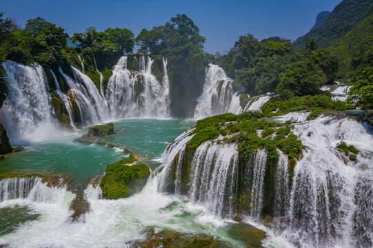 Aerial view of Detian Transnational Waterfalls along the river at Moon Hill Yangshuo valley, Chongzuo City, Yangshuo County, Guilin, Guangxi Zhuang Autonomous Region, China.