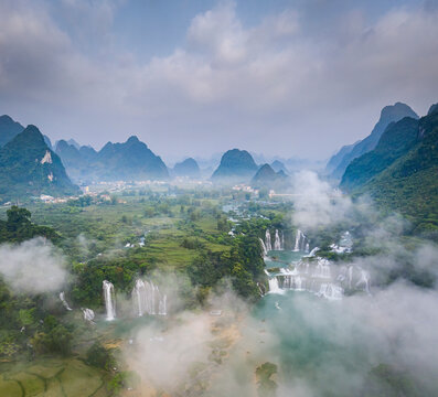 Aerial view of Detian Transnational Waterfalls along the river at Moon Hill Yangshuo valley, Chongzuo City, Yangshuo County, Guilin, Guangxi Zhuang Autonomous Region, China.