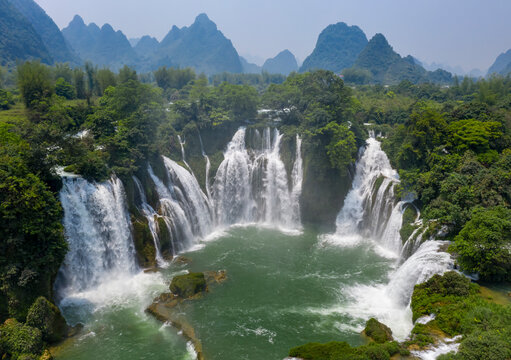 Aerial view of Detian Transnational Waterfalls along the river at Moon Hill Yangshuo valley, Chongzuo City, Yangshuo County, Guilin, Guangxi Zhuang Autonomous Region, China.