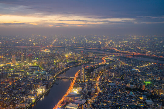 Aerial view of Tokyo skyline at sunset along the Sumida river, Japan.