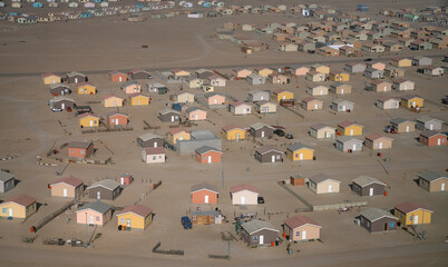 Aerial view of a few houses near Walvis Bay, Namib Desert, Namibia, Africa.