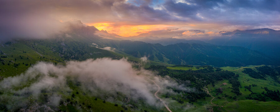 Aerial view of beautiful mountain landscape at sunset in Karachay-Cherkess, Elbrus, Khabaz, Kebardino Balkaria, Caucasus, Russia.