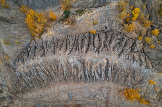Aerial view of a river with trees in autumn colours in Konduki, Tula region, Russia.