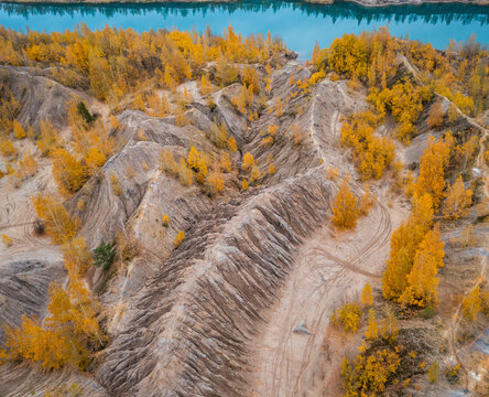 Aerial view of a river with trees in autumn colours in Konduki, Tula region, Russia.