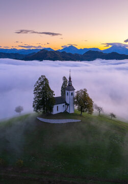 Aerial drone view of the beautiful hilltop church of Sveti Tomaz (Saint Thomas) Skofja loka, Slovenia.