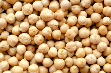 Dry chickpeas background, top view. Chickpea seeds background, close-up. Chickpeas close-up, top...