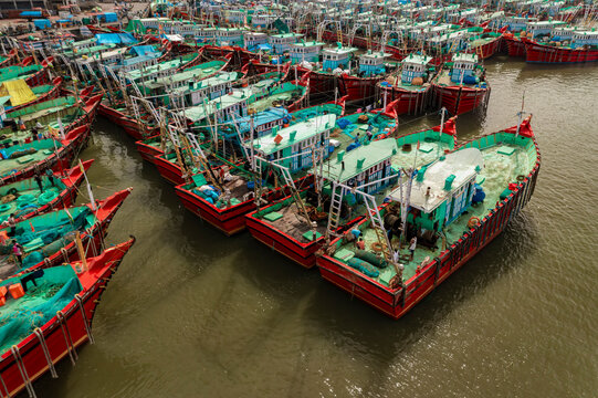 Aerial view of many boats and fishing boats docket at Malpe New Port, Udupi, Karnataka, India.