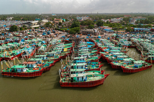 Aerial view of many boats and fishing boats docket at Malpe New Port, Udupi, Karnataka, India.