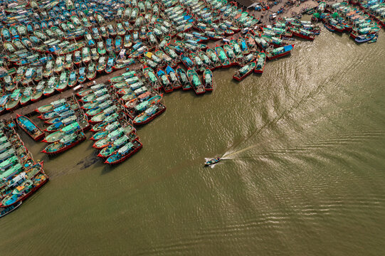 Aerial view of a boat sailing at Malpe New Port, Udupi, Karnataka, India.