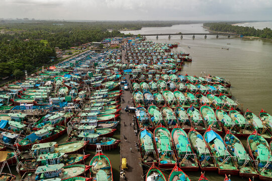 Aerial view of many boats and fishing boats docket at Malpe New Port, Udupi, Karnataka, India.