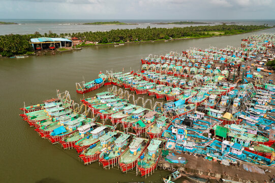 Aerial view of many boats and fishing boats docket at Malpe New Port, Udupi, Karnataka, India.