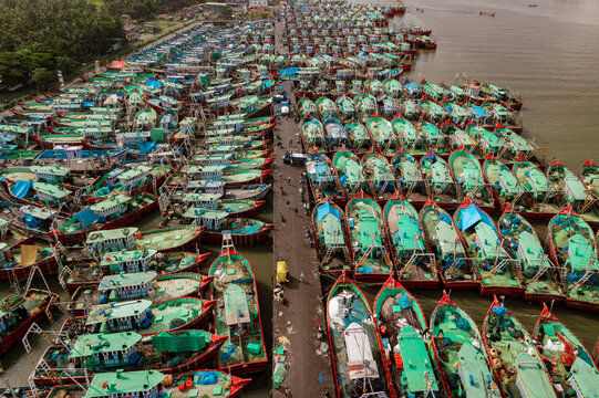 Aerial view of many boats and fishing boats docket at Malpe New Port, Udupi, Karnataka, India.