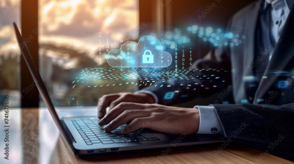 Poster person's hands typing on a laptop with a digital overlay of a secure cloud network graphic, implying