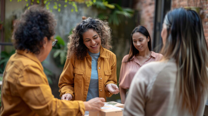 Obraz premium people is engaging in a cheerful conversation on a sunny day in an urban setting, with one person holding a piece of clothing.