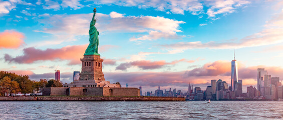 Statue of Liberty and Downtown Manhattan in the background.