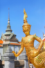 Bangkok, Thailand, a close up of the golden Asura Wayupuk, a mythic demon half monkey and half bird, belonging to Wat Phra Kaew temple