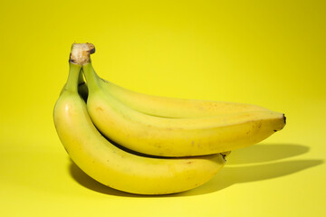 Bunch of bananas on the yellow background