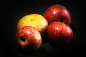 Apple annurca Campana on black background