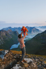 Father hiking with infant baby outdoor family active healthy lifestyle traveling in Norway summer vacations man with child exploring Lofoten islands, Fathers day holiday - 741699050