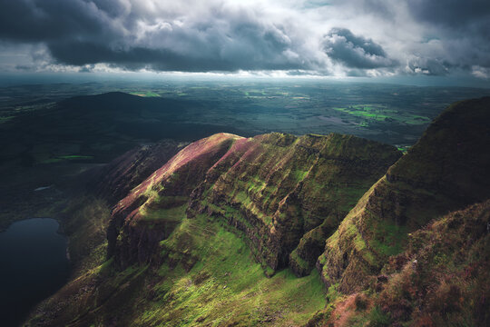 Storm clouds over Coumshingaun Lough and Kilclooney Loop, Comeragh Mountains, County Waterford, Ireland