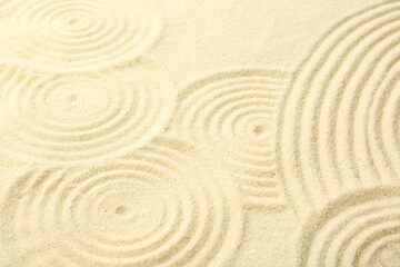 Zen rock garden. Circle patterns on beige sand, closeup