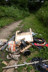 Fly-tipping along an isolated country byway, Burghclere, Hampshire, England, UK