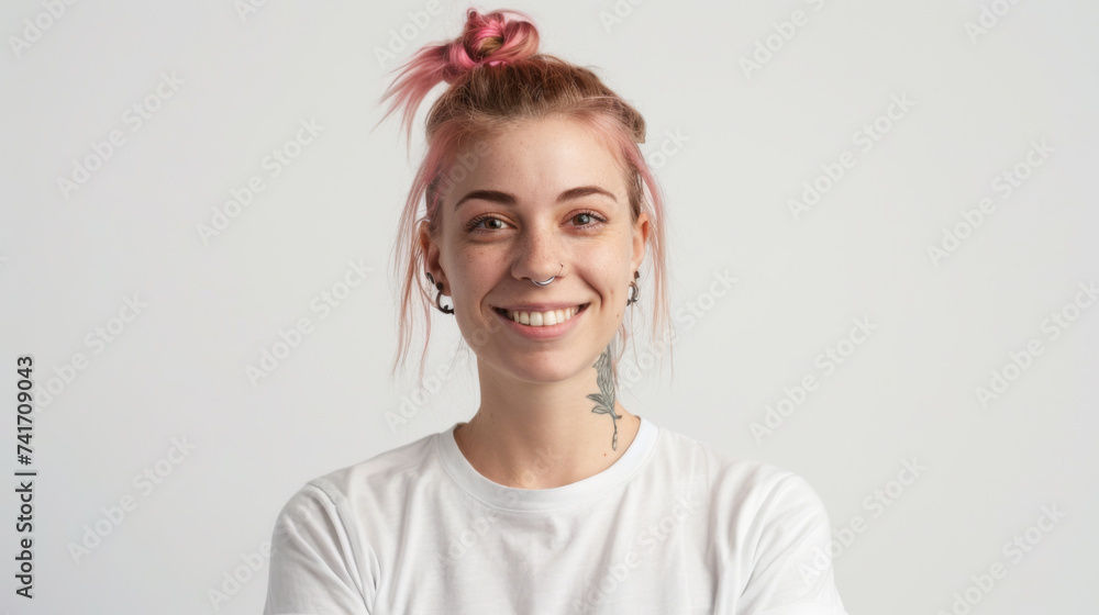 Poster young woman with a cheerful smile, sporting a trendy top bun with pink hair, a nose ring, and visibl