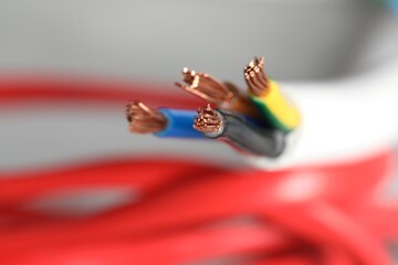 Colorful electrical wire on blurred background, closeup